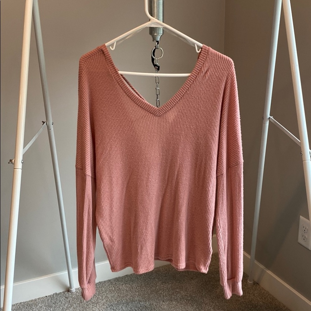 Pink/rose color sweater with fun back detail. NWT